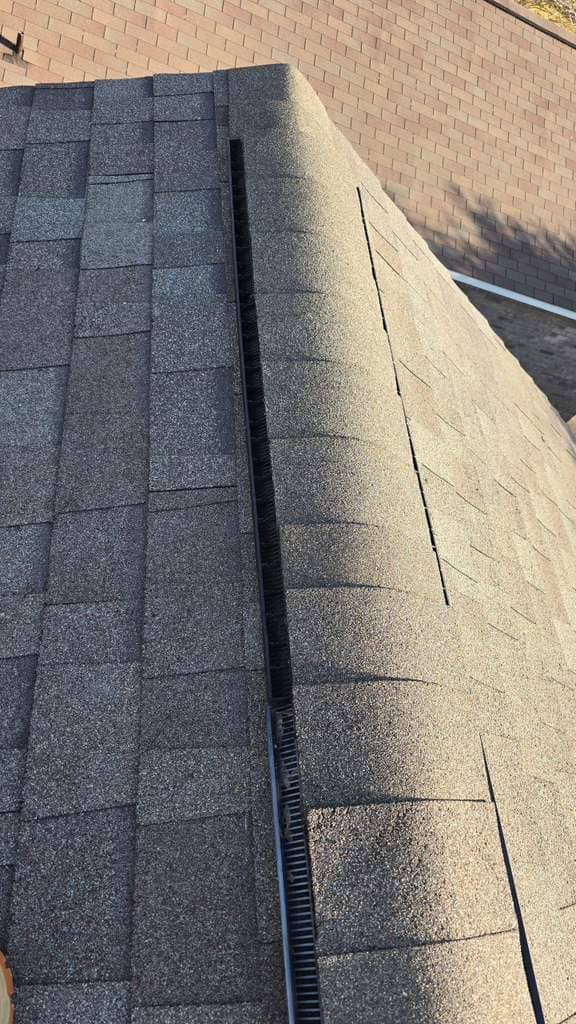 Roofing assessment Navasota Texas shingles with backyard fence view