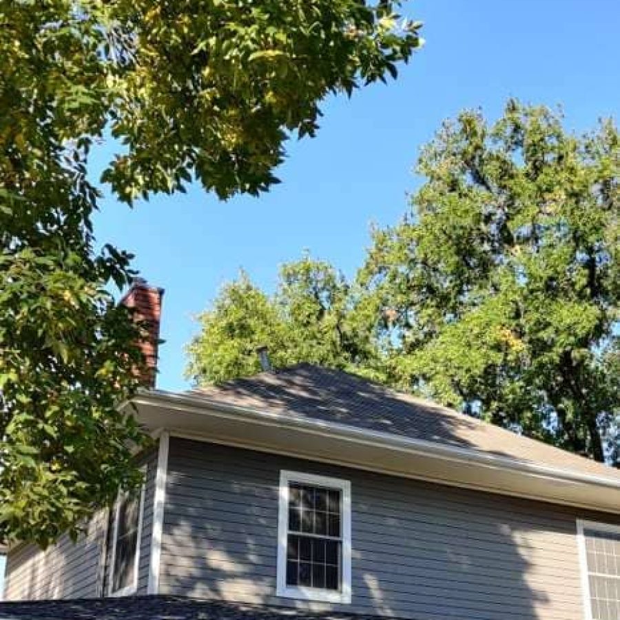 Roof repair work Navasota Texas ladder setup on porch